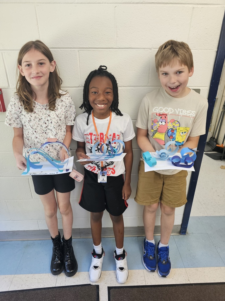 Students with wave sculptures
