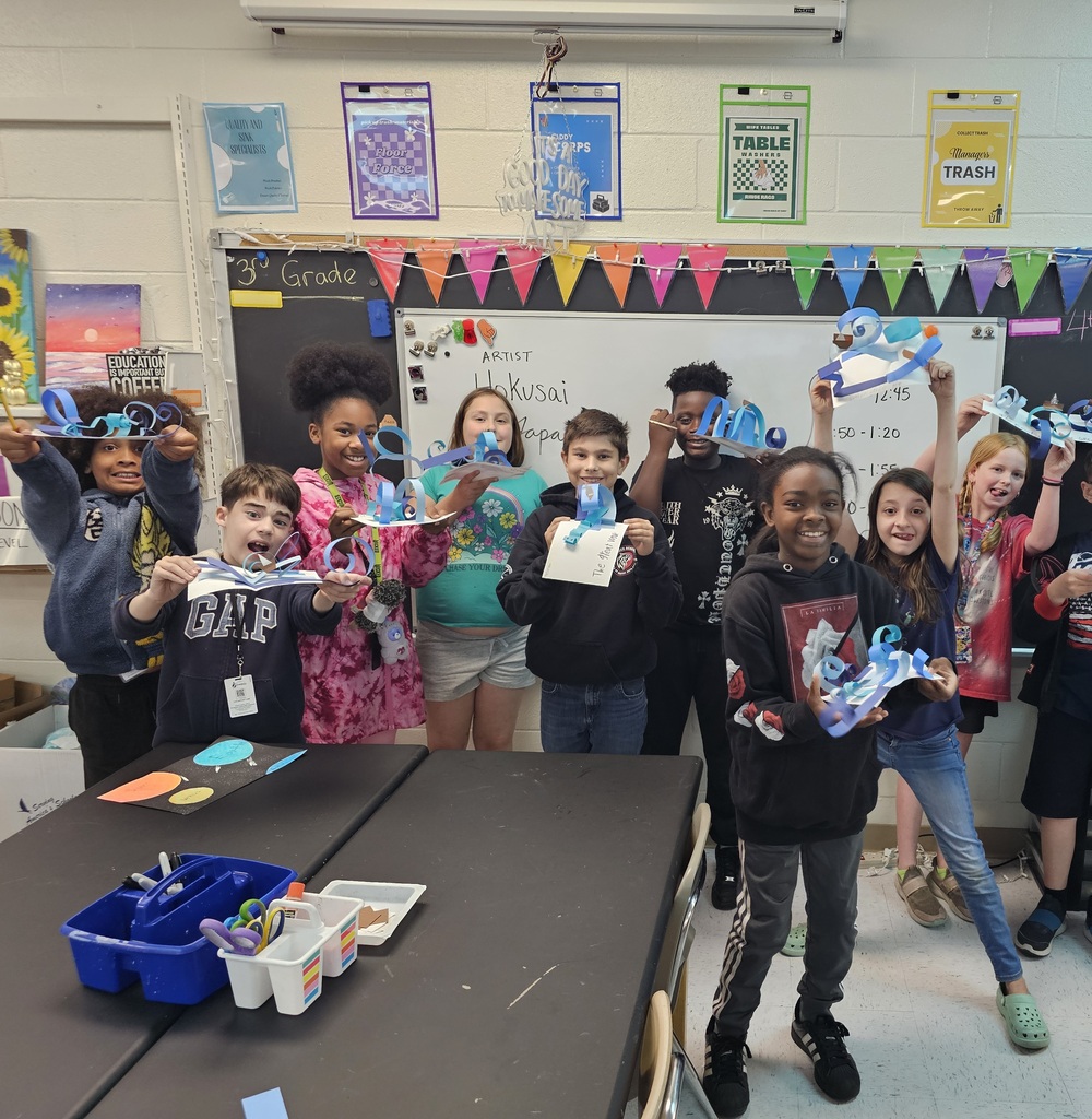 Students with wave sculptures