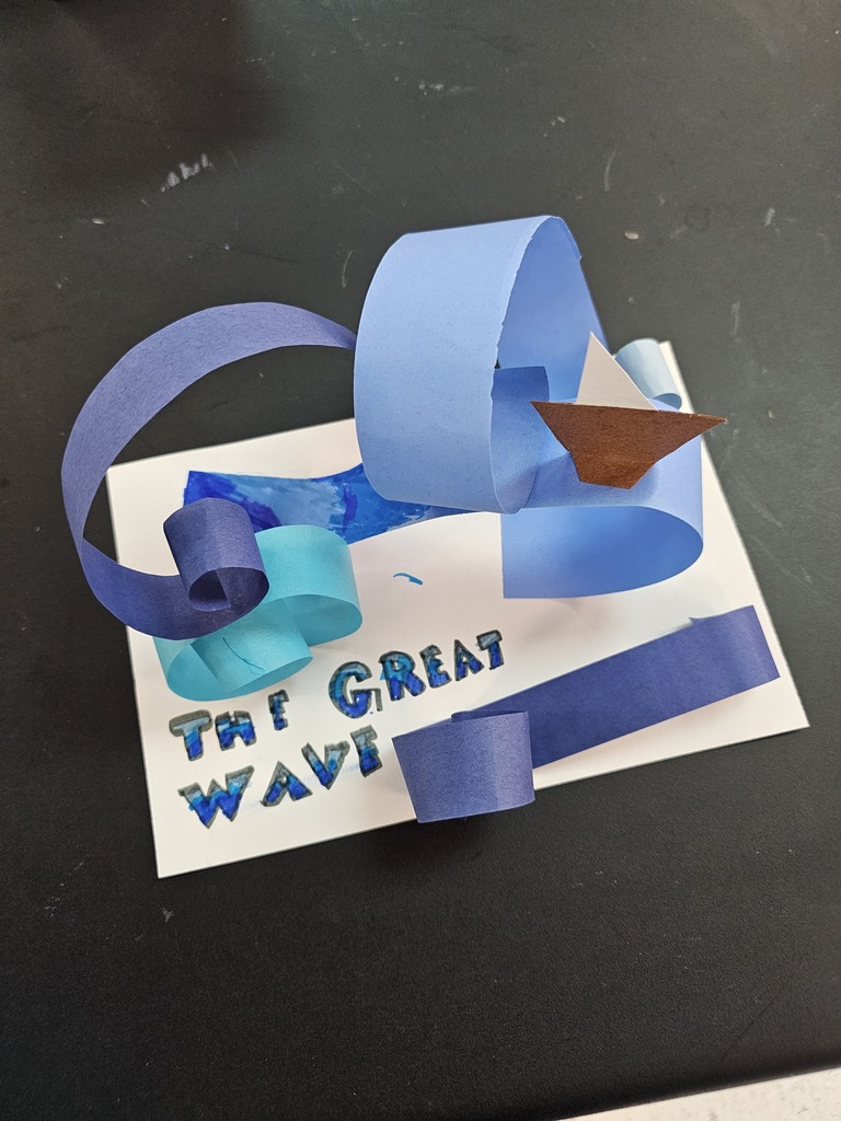 Students with wave sculptures