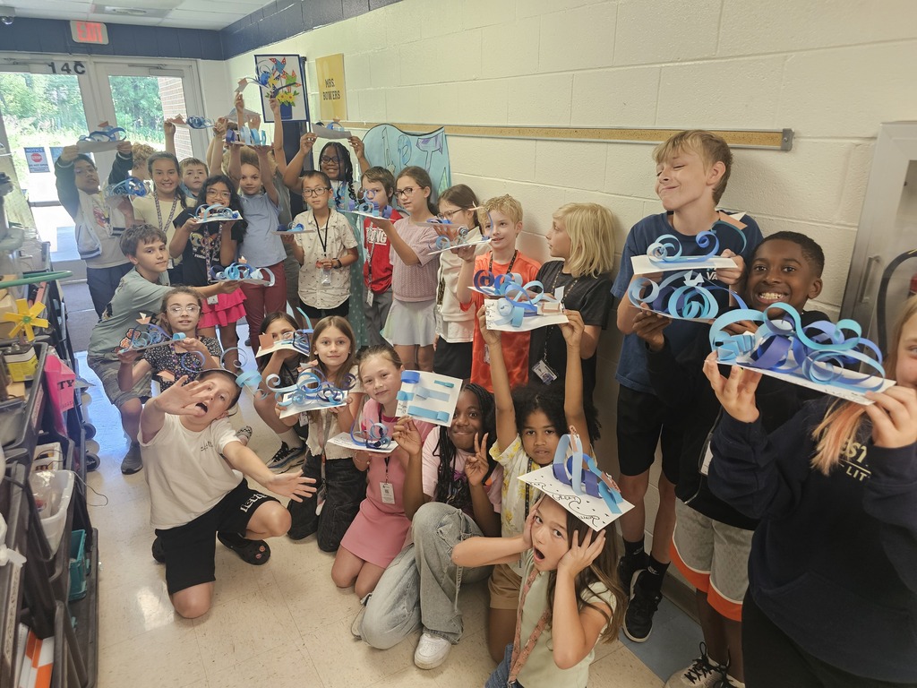 Students with wave sculptures