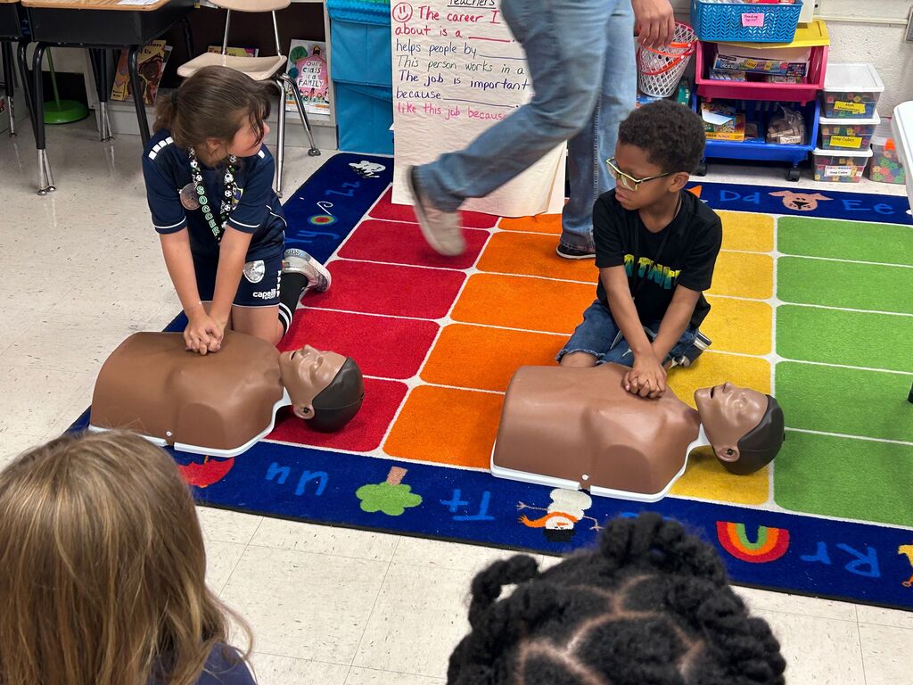 students and presenters at community helpers day