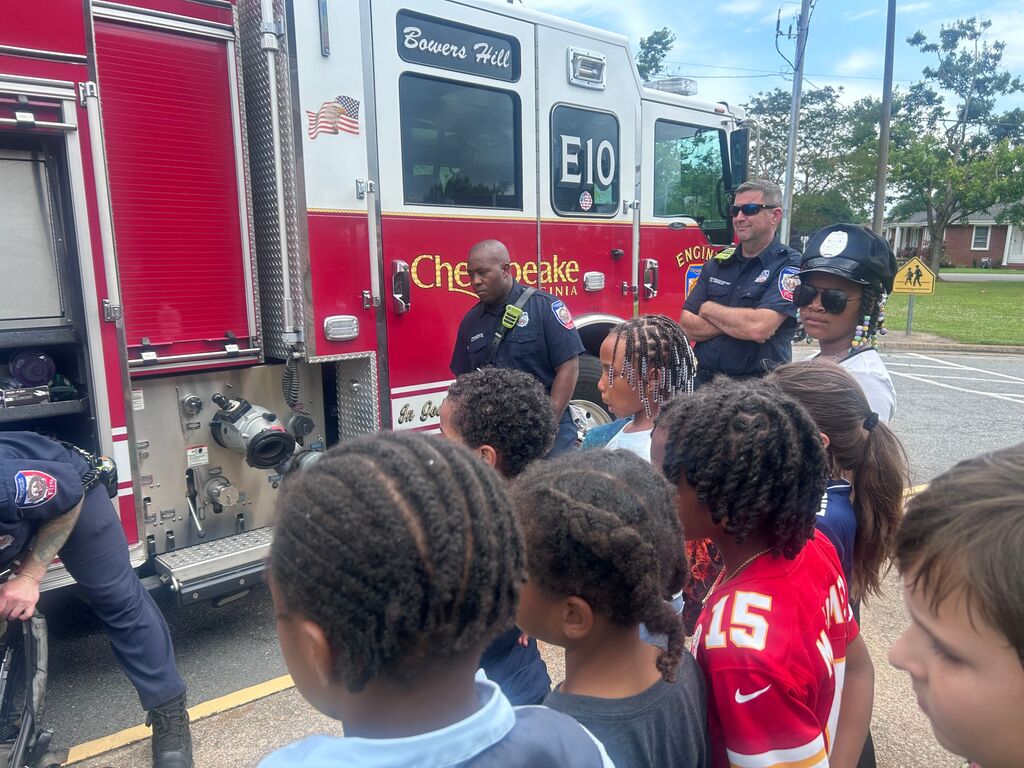 students and presenters at community helpers day
