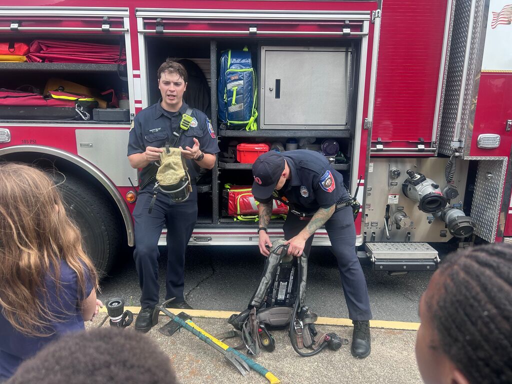 students and presenters at community helpers day