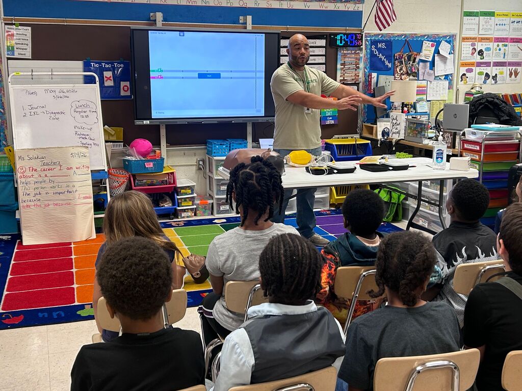 students and presenters at community helpers day