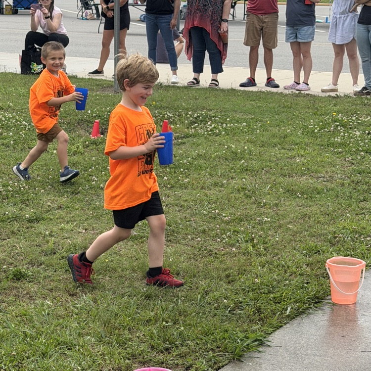 Students at the water relay station at field day 