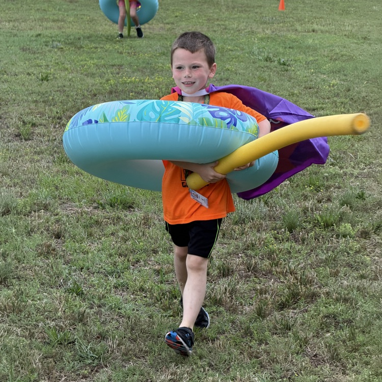 Student having fun at one of the relays at field day 