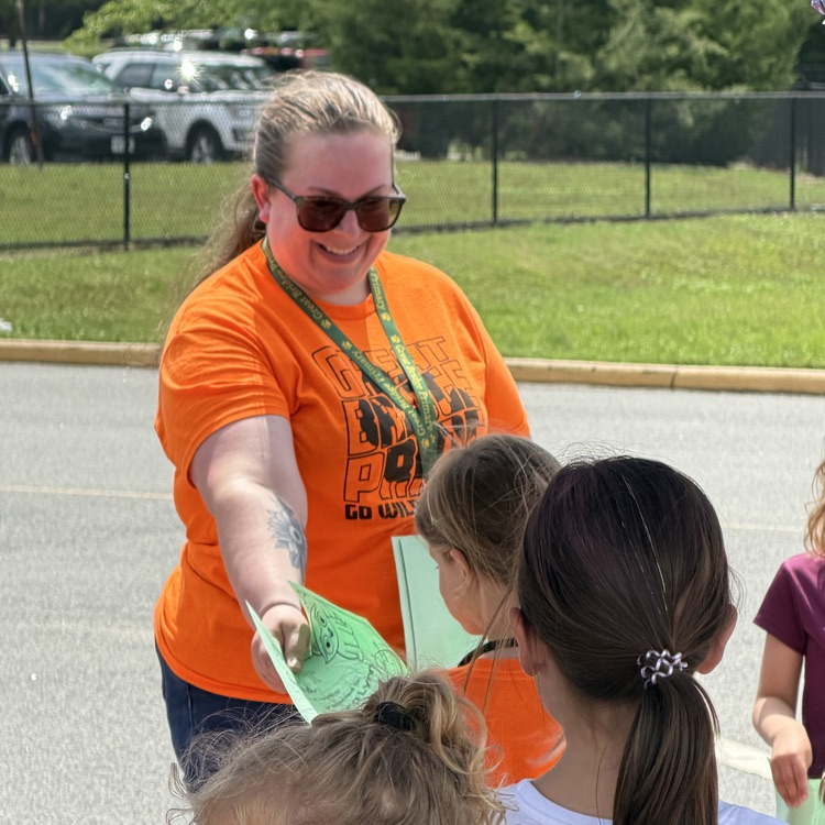 Mrs Jones handing out an award to a student during her end of year party