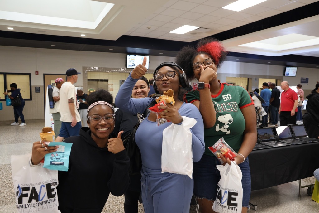 A family giving a thumbs up to the event.