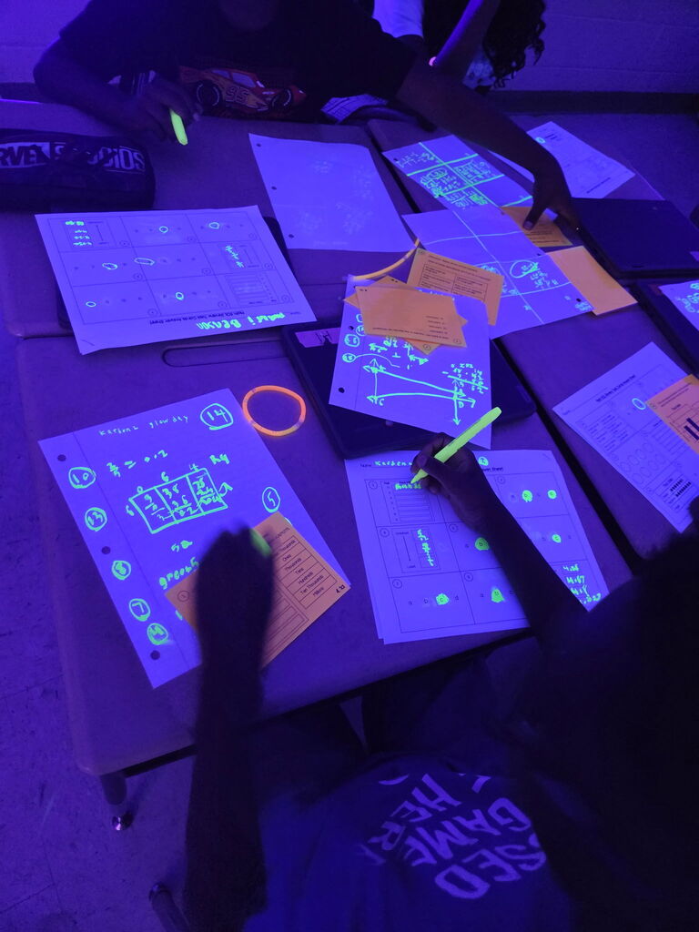 students practicing math in black light