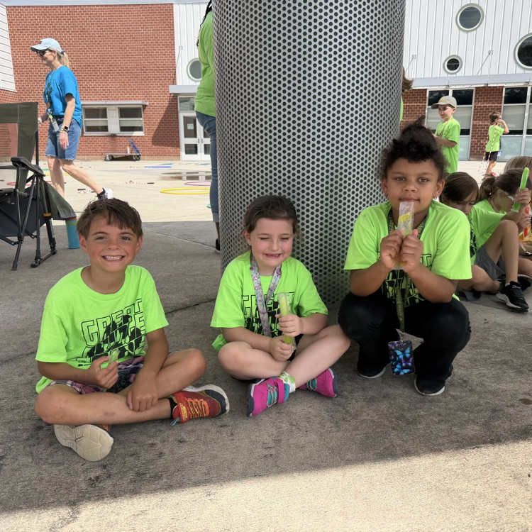 students enjoying ice pops at field day