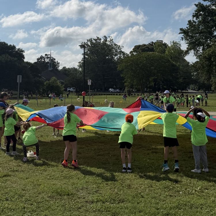 students playing with the parachute at field day