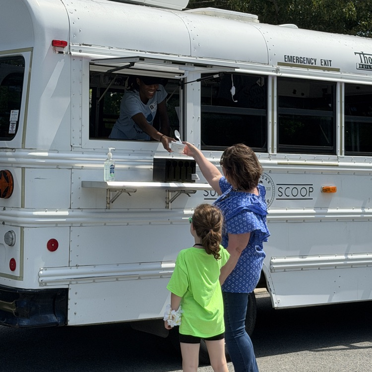 A student and Mrs. Brinn at the ice cream place truck on field day