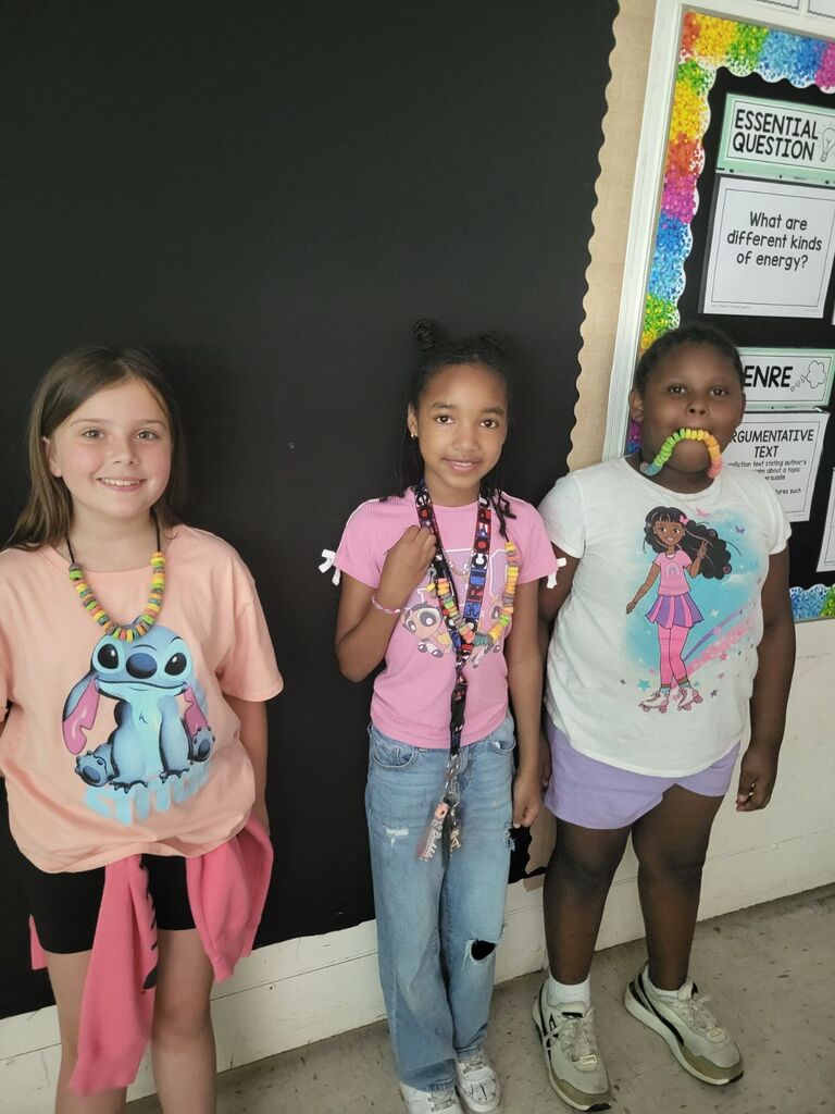 Students making necklaces 