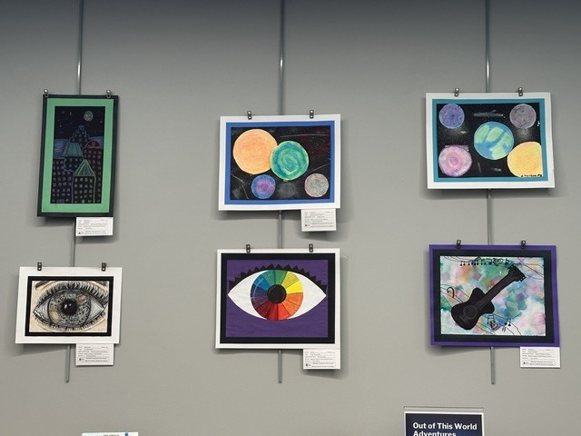 WBI student's artwork on the wall at the library