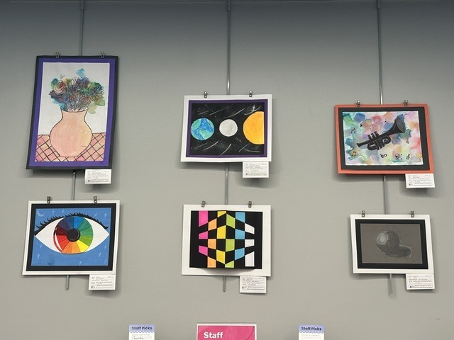 WBI student's artwork on the wall at the library