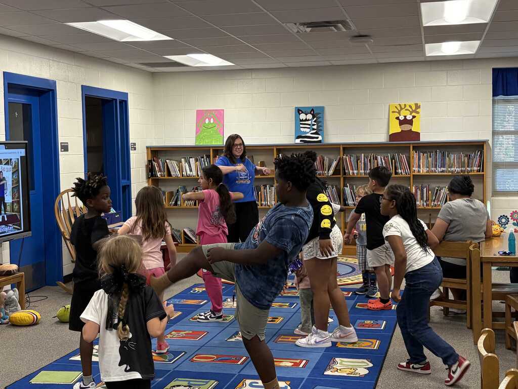 Mrs. Steadman leading students in exercises.