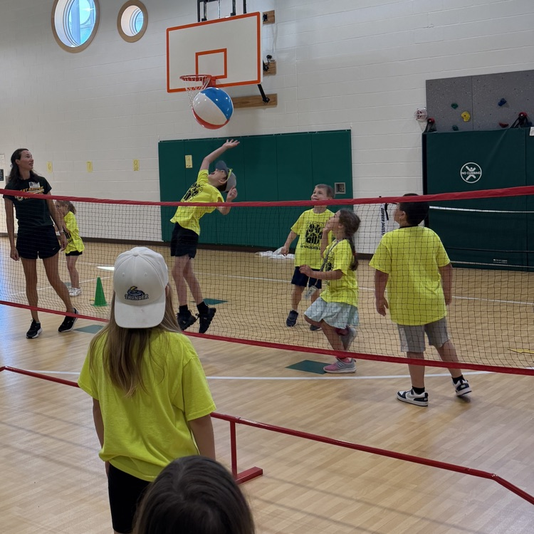 students playing beach ball volley ball on field day