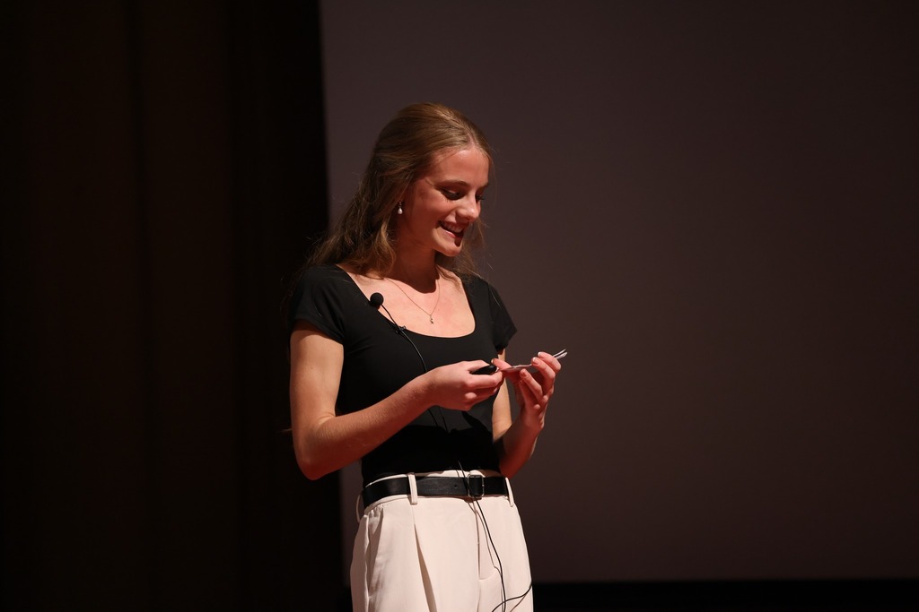 Student giving her TEDx talk.