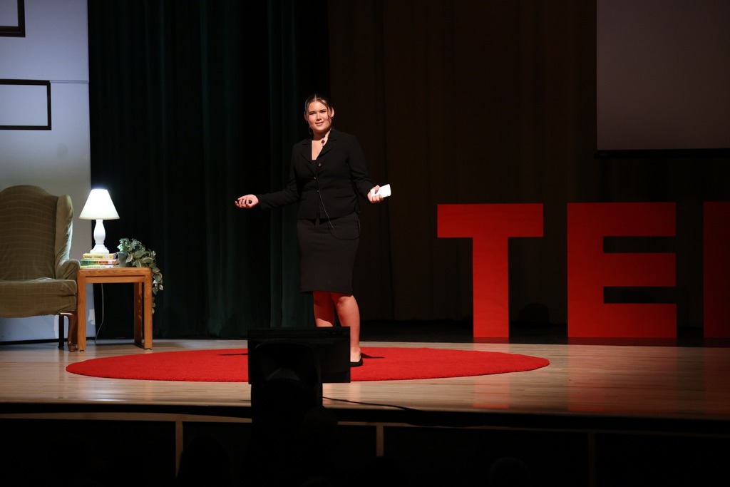 Student speaking on stage.