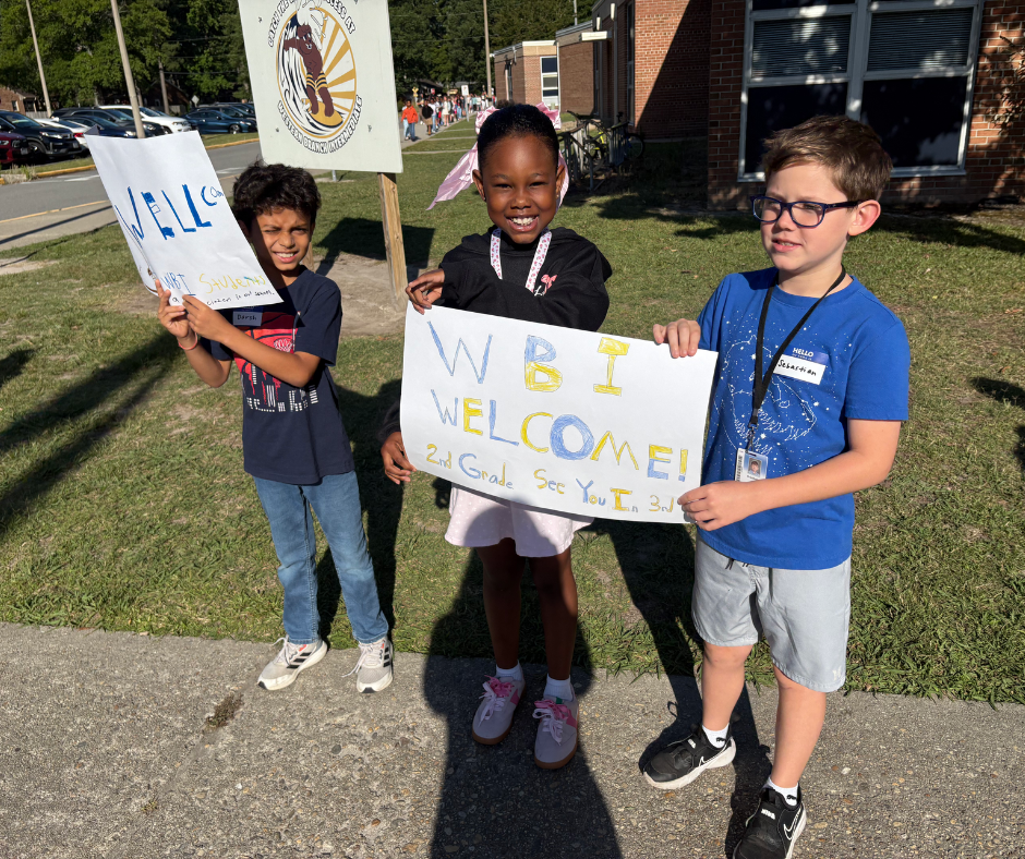 Student holding sign 