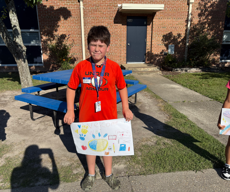 Student holding sign 