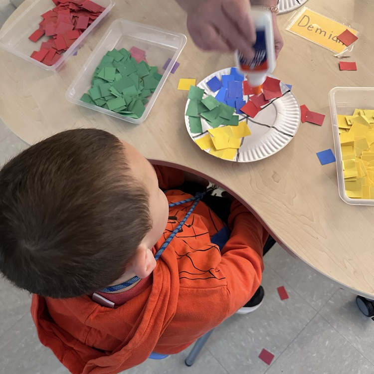 Students creating a beach ball paper craft! 