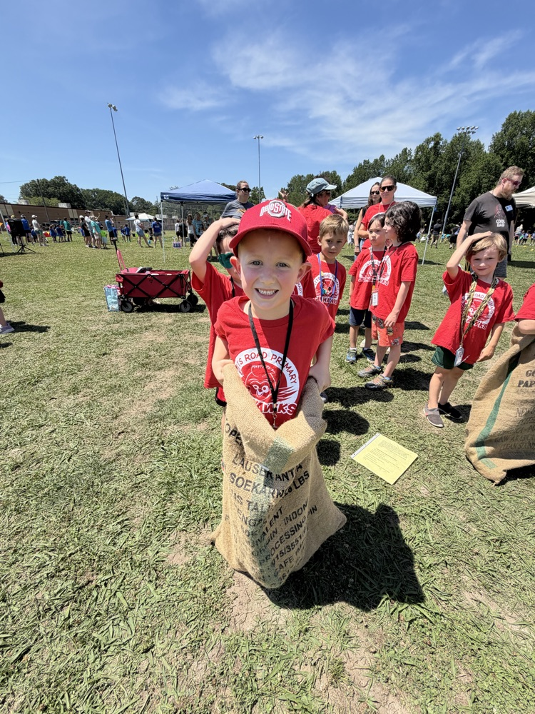 Child, jumping in potato sack