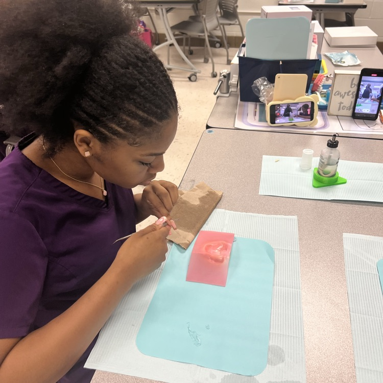 students making a fake tooth