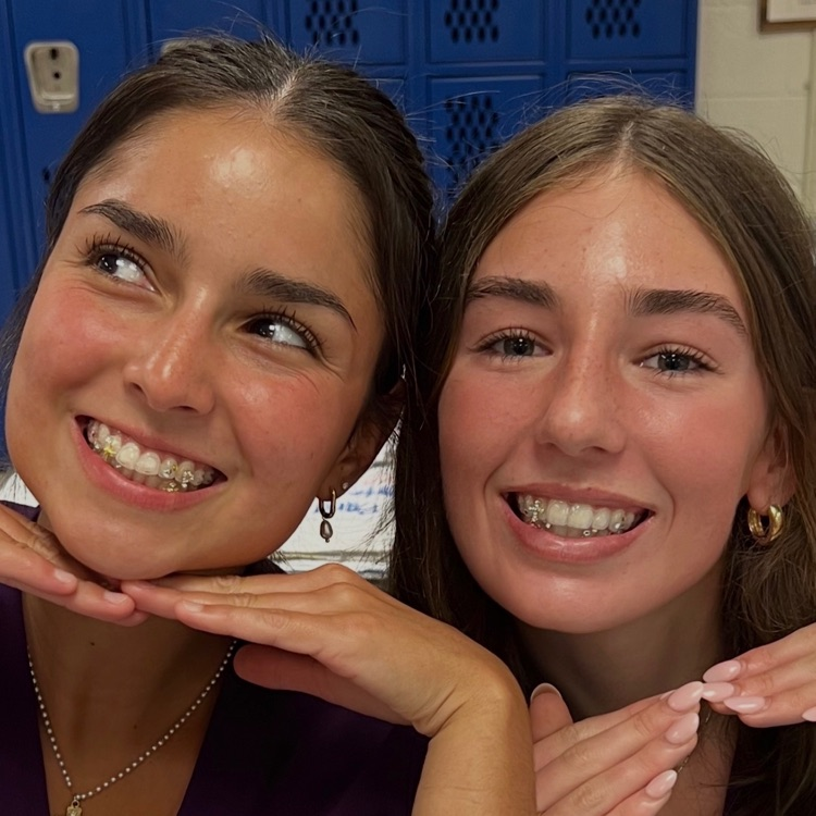 students smiling with tooth gems
