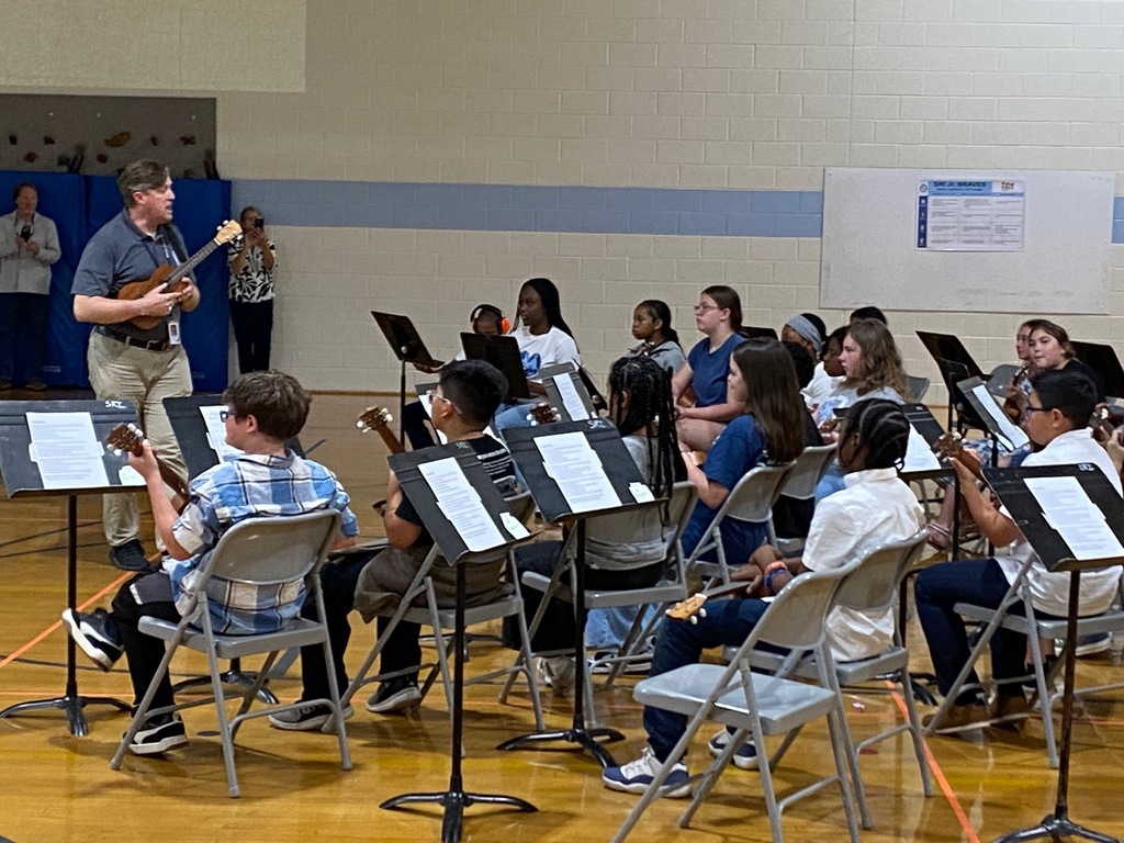 Ukulele students performing in the gym.