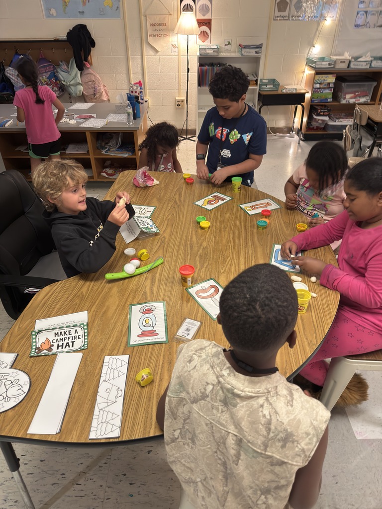 students working on Play-Doh mats