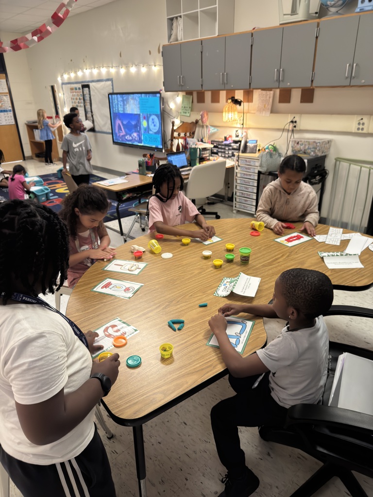students working on Play-Doh mats