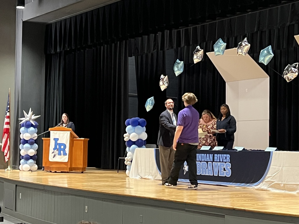 Student receiving recognition during the school's 2025–2026 Academic Awards Ceremony.