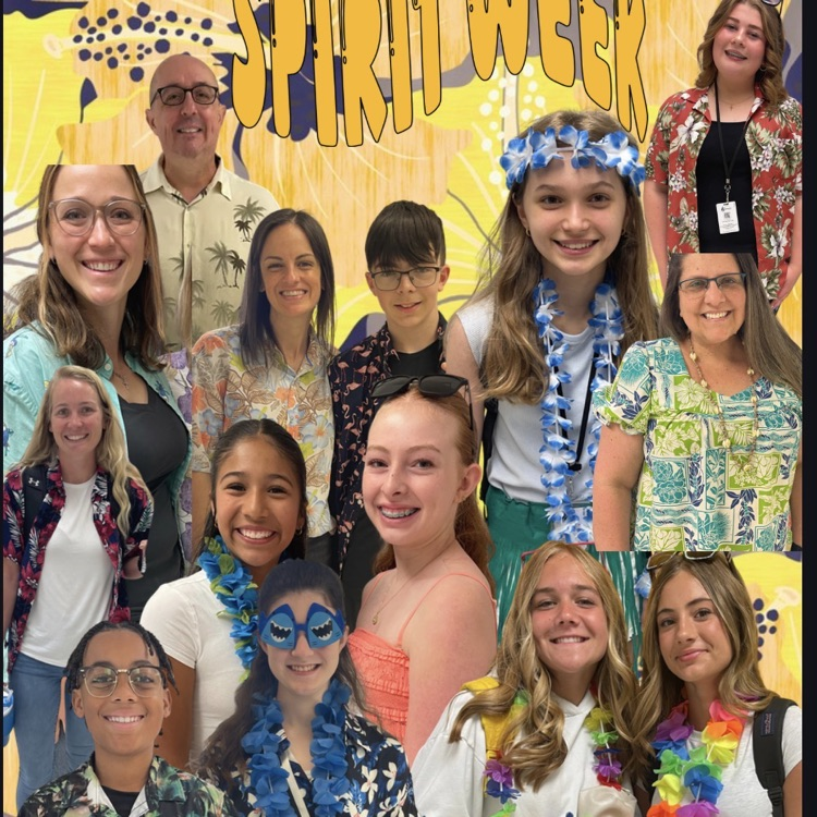 students posing and smiling in a Hawaiian gear or Hawaiian shirt