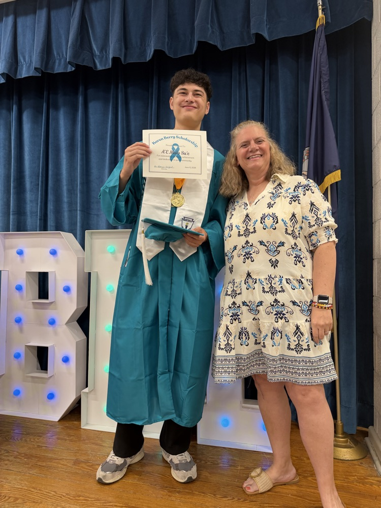 recipient with teacher holding certificate
