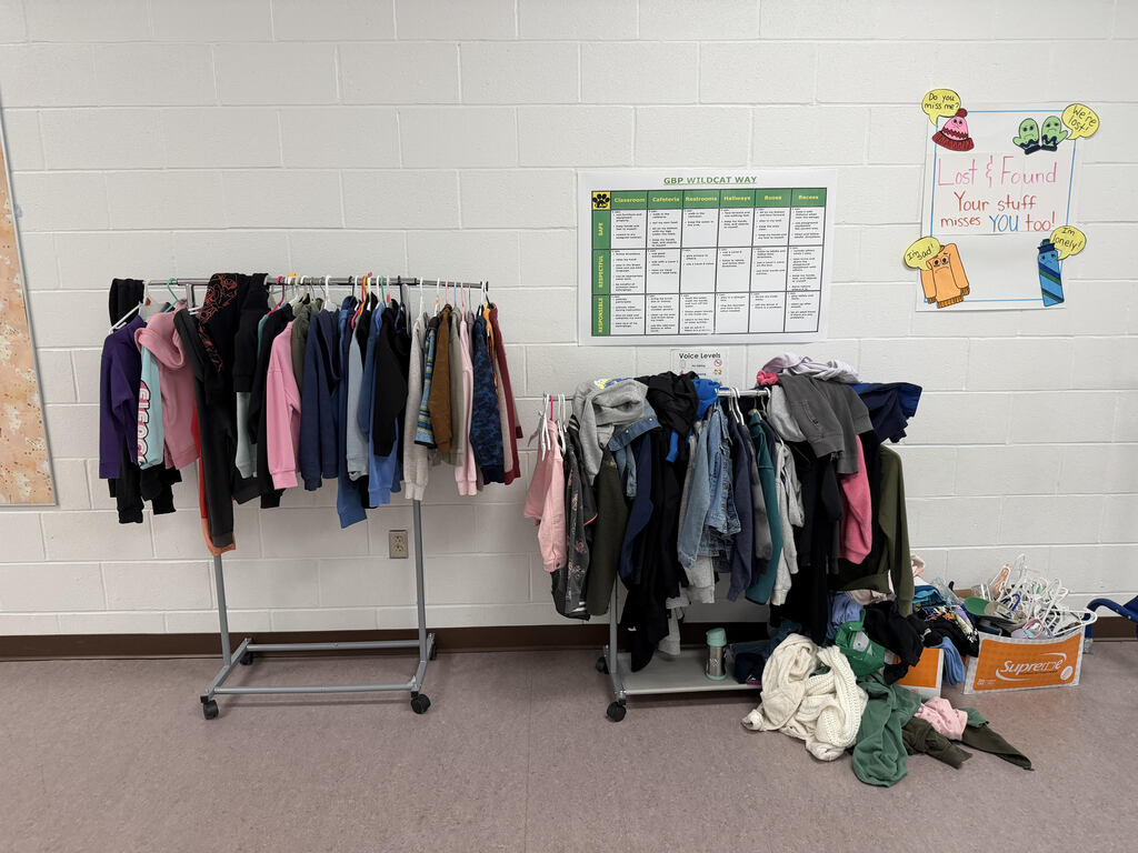 A picture of GBP's lost and found that includes many jackets and other clothing items that students are missing.