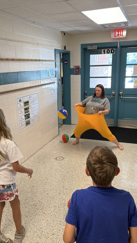 teacher playing game with students