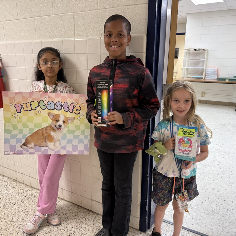 A photo of happy students holding their prizes from the Student Appreciation Week raffle.