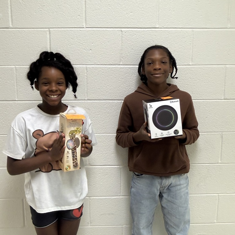 A photo of happy students holding their prizes from the Student Appreciation Week raffle.