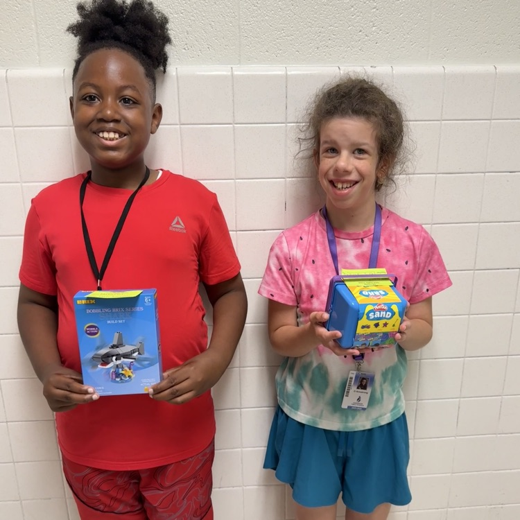 A photo of happy students holding their prizes from the Student Appreciation Week raffle.