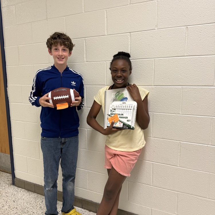 A photo of happy students holding their prizes from the Student Appreciation Week raffle.