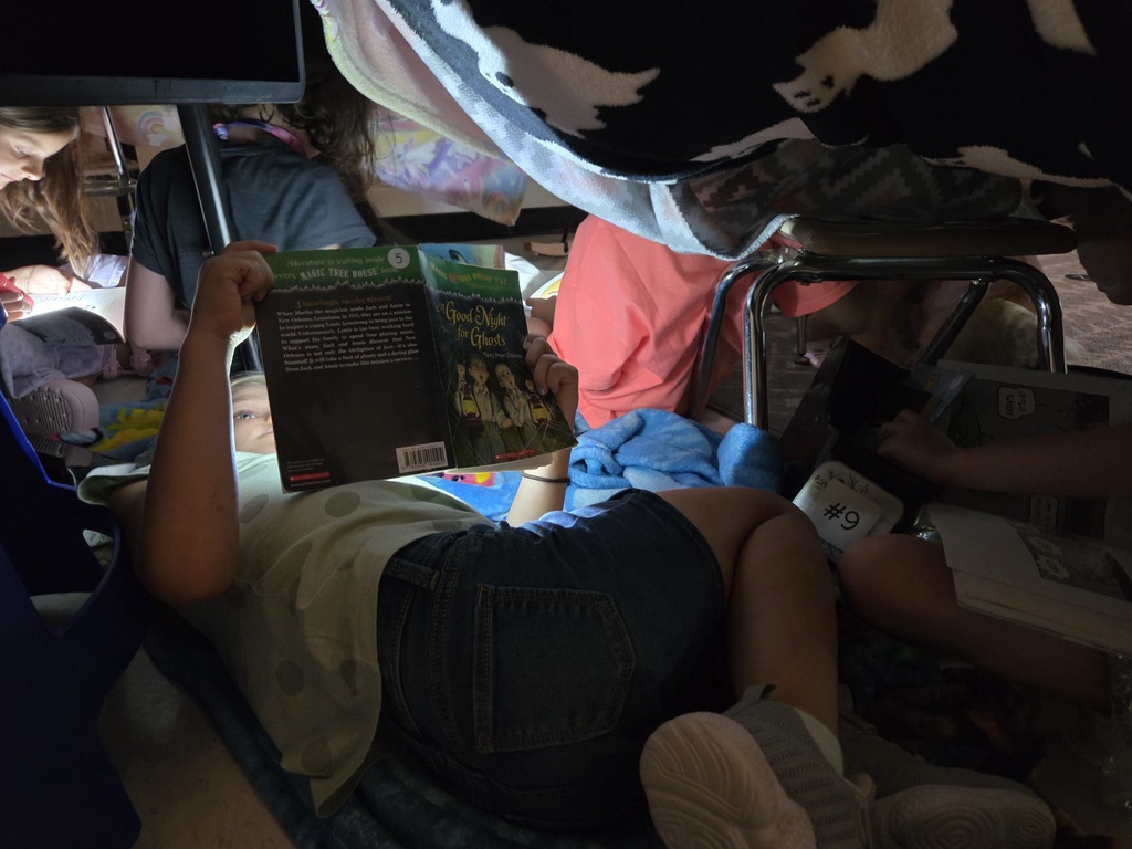 It was Campout Reading Day in Miss Stafford's class today. Students had fun building blanket tents to read in and they even got a special visit from Miss Stafford's mom who read them the story Curious George Goes Camping!