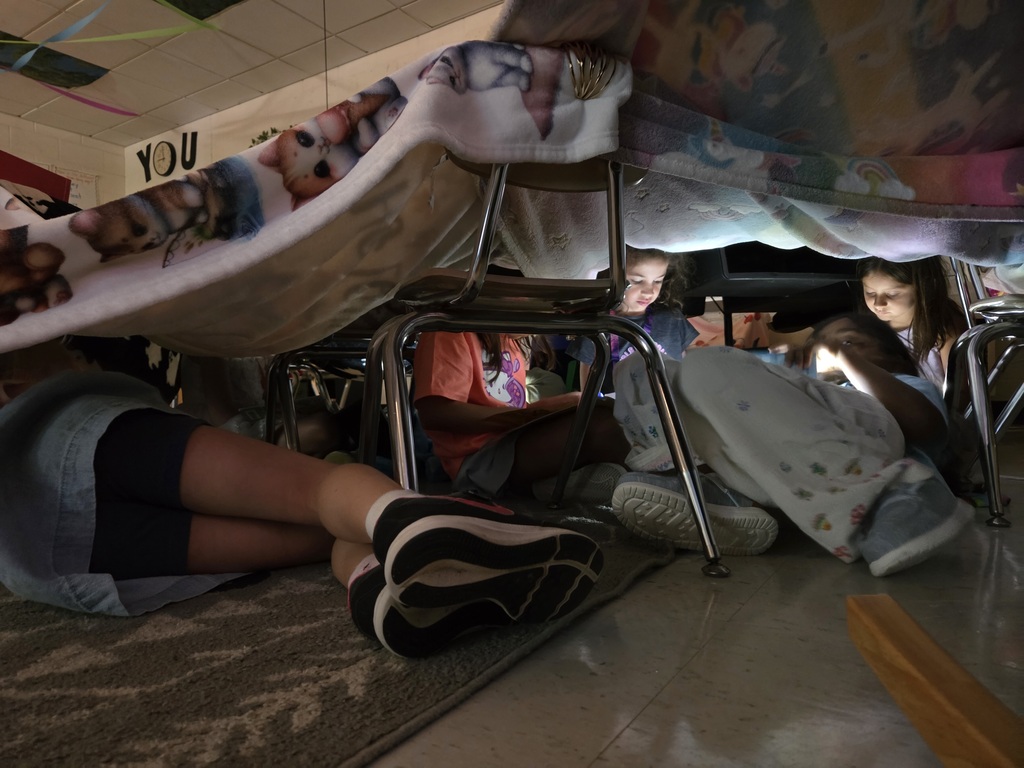 It was Campout Reading Day in Miss Stafford's class today. Students had fun building blanket tents to read in and they even got a special visit from Miss Stafford's mom who read them the story Curious George Goes Camping!