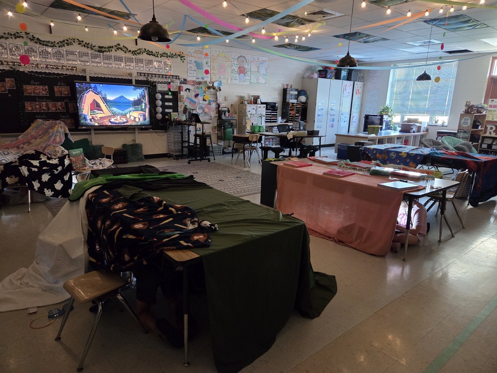 It was Campout Reading Day in Miss Stafford's class today. Students had fun building blanket tents to read in and they even got a special visit from Miss Stafford's mom who read them the story Curious George Goes Camping!