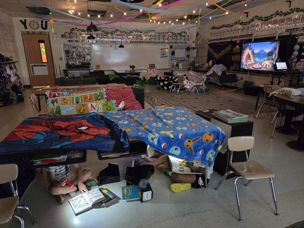 It was Campout Reading Day in Miss Stafford's class today. Students had fun building blanket tents to read in and they even got a special visit from Miss Stafford's mom who read them the story Curious George Goes Camping!