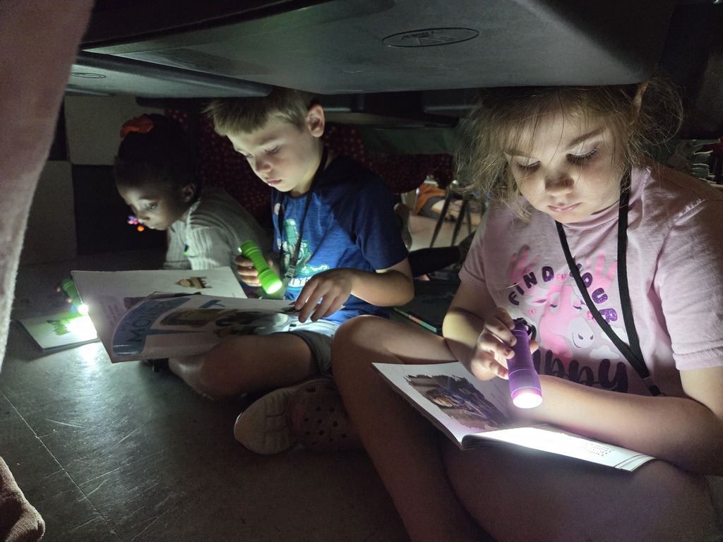 It was Campout Reading Day in Miss Stafford's class today. Students had fun building blanket tents to read in and they even got a special visit from Miss Stafford's mom who read them the story Curious George Goes Camping!