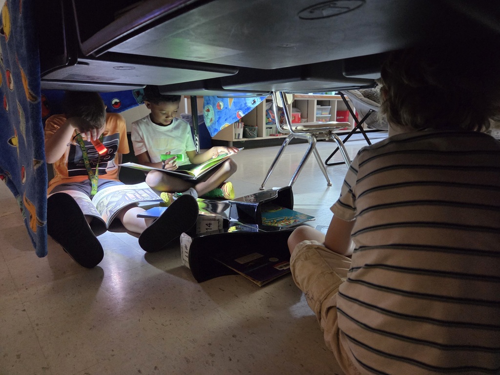 It was Campout Reading Day in Miss Stafford's class today. Students had fun building blanket tents to read in and they even got a special visit from Miss Stafford's mom who read them the story Curious George Goes Camping!