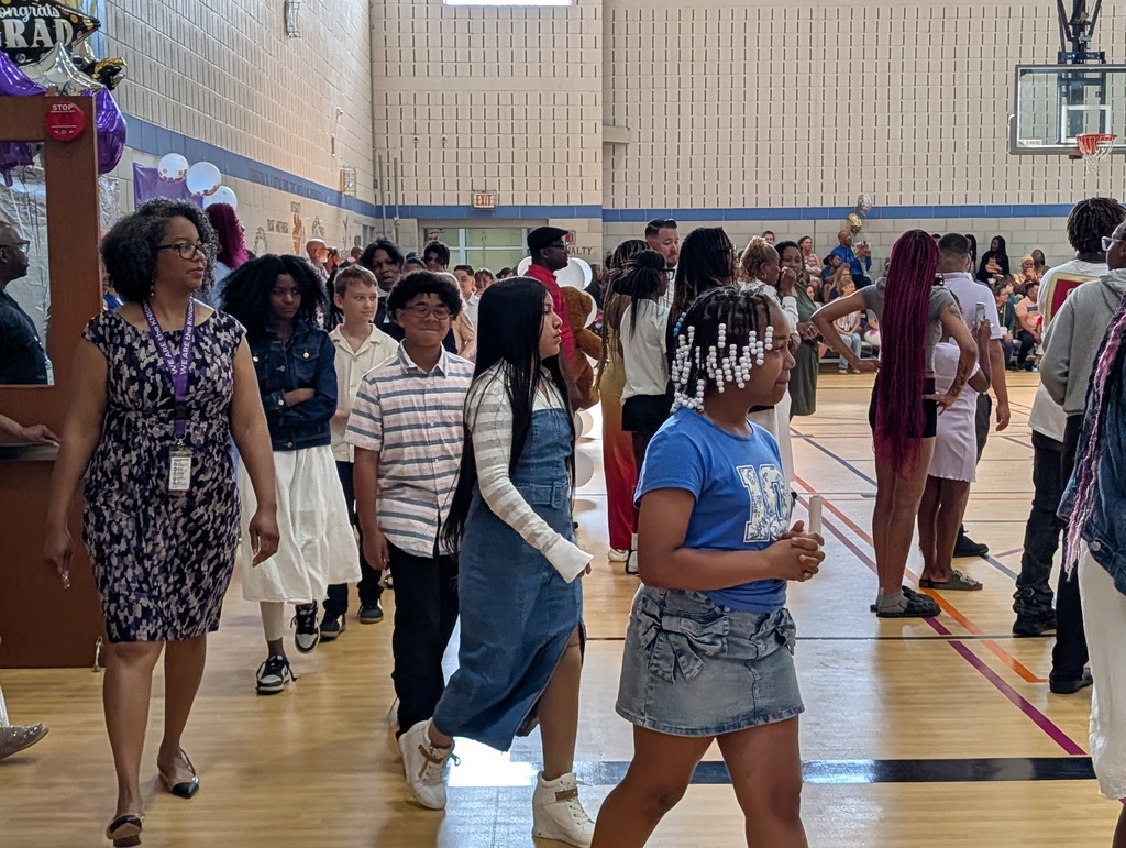 students walking over to the stage