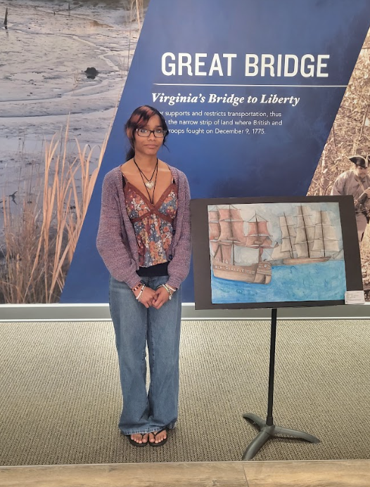 WBHS student posing next to her artwork for SAIL250