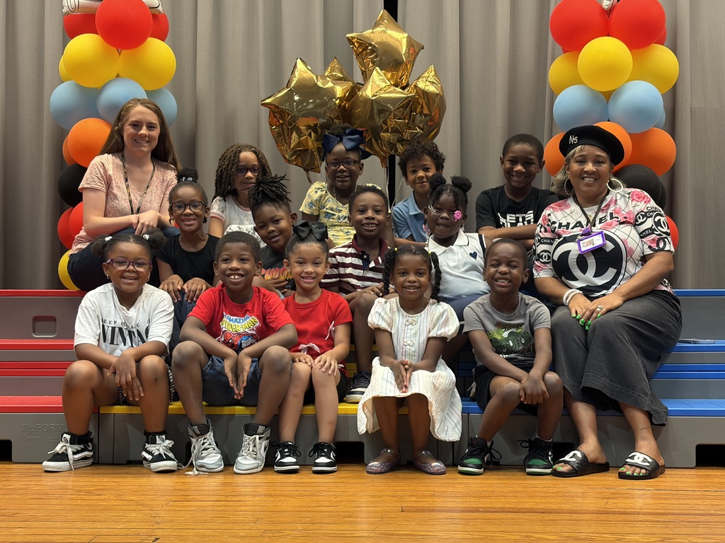 kindergarten students on stage with balloons
